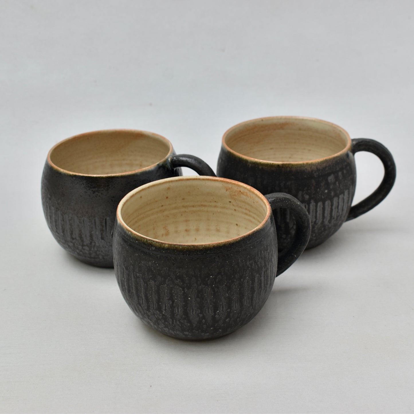 Stoneware fireflower cup with stripe design
