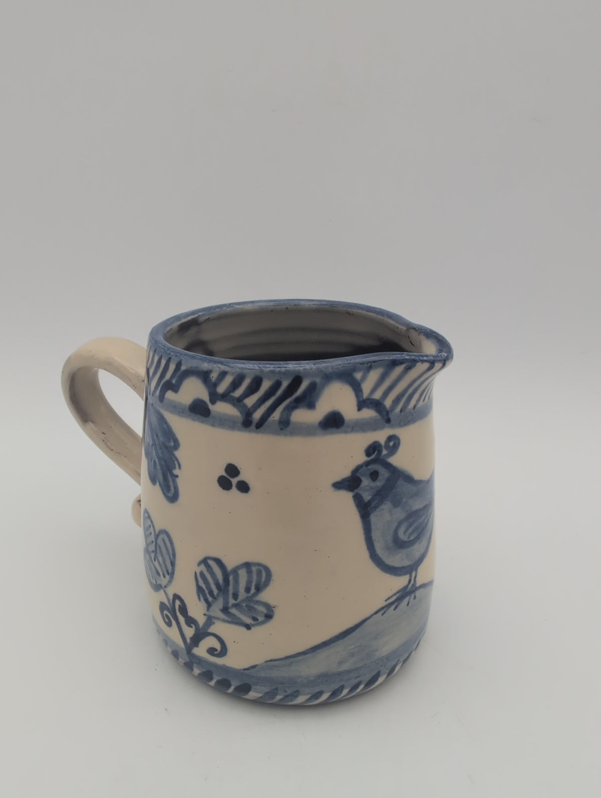 Hand thrown blue and white jug