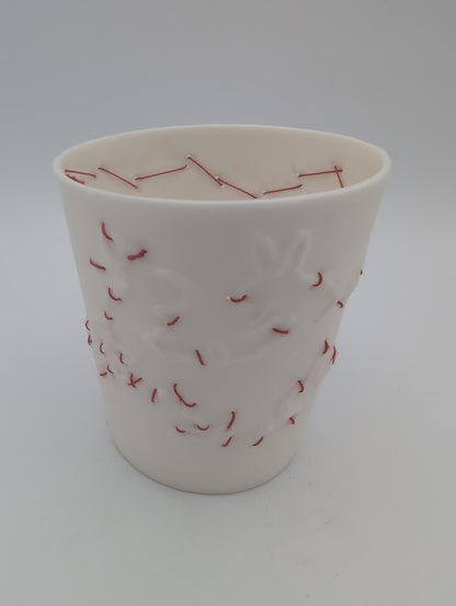 Porcelain beaker with silk hand stitching