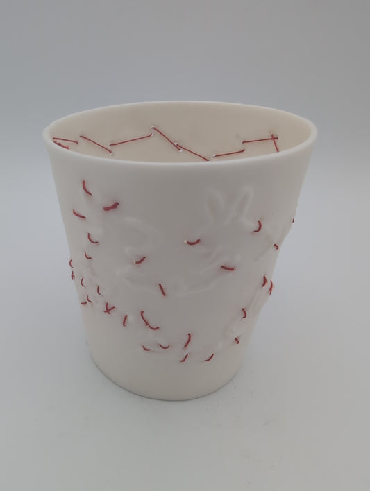 Porcelain beaker with silk hand stitching