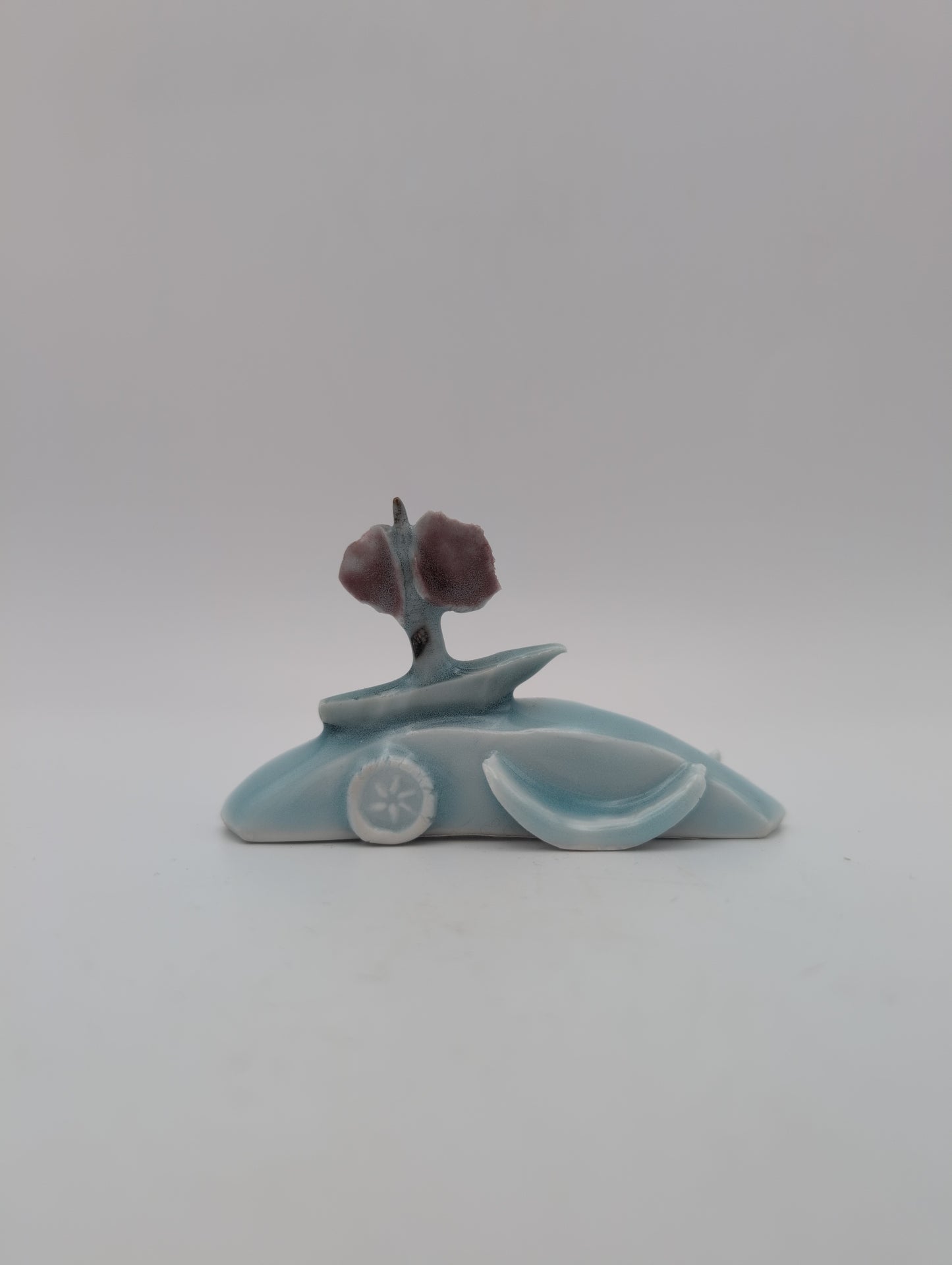 Porcelain boat and waves small sculpture