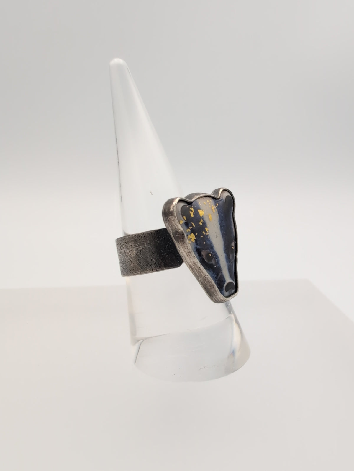 Enamel badger ring with emerald