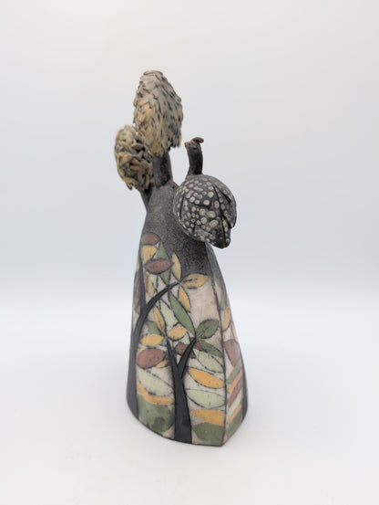 Guinea fowl on a hill