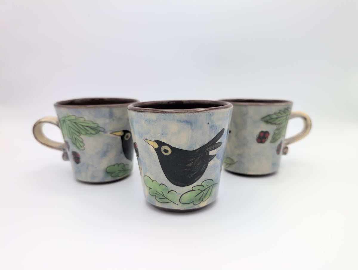 Hand thrown blackbird mug