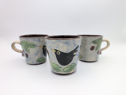 Hand thrown blackbird mug