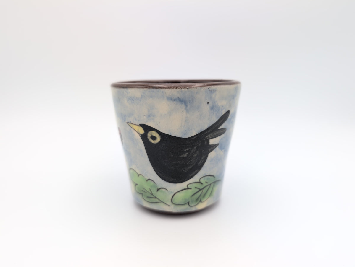 Hand thrown blackbird mug