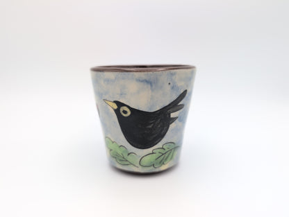 Hand thrown blackbird mug