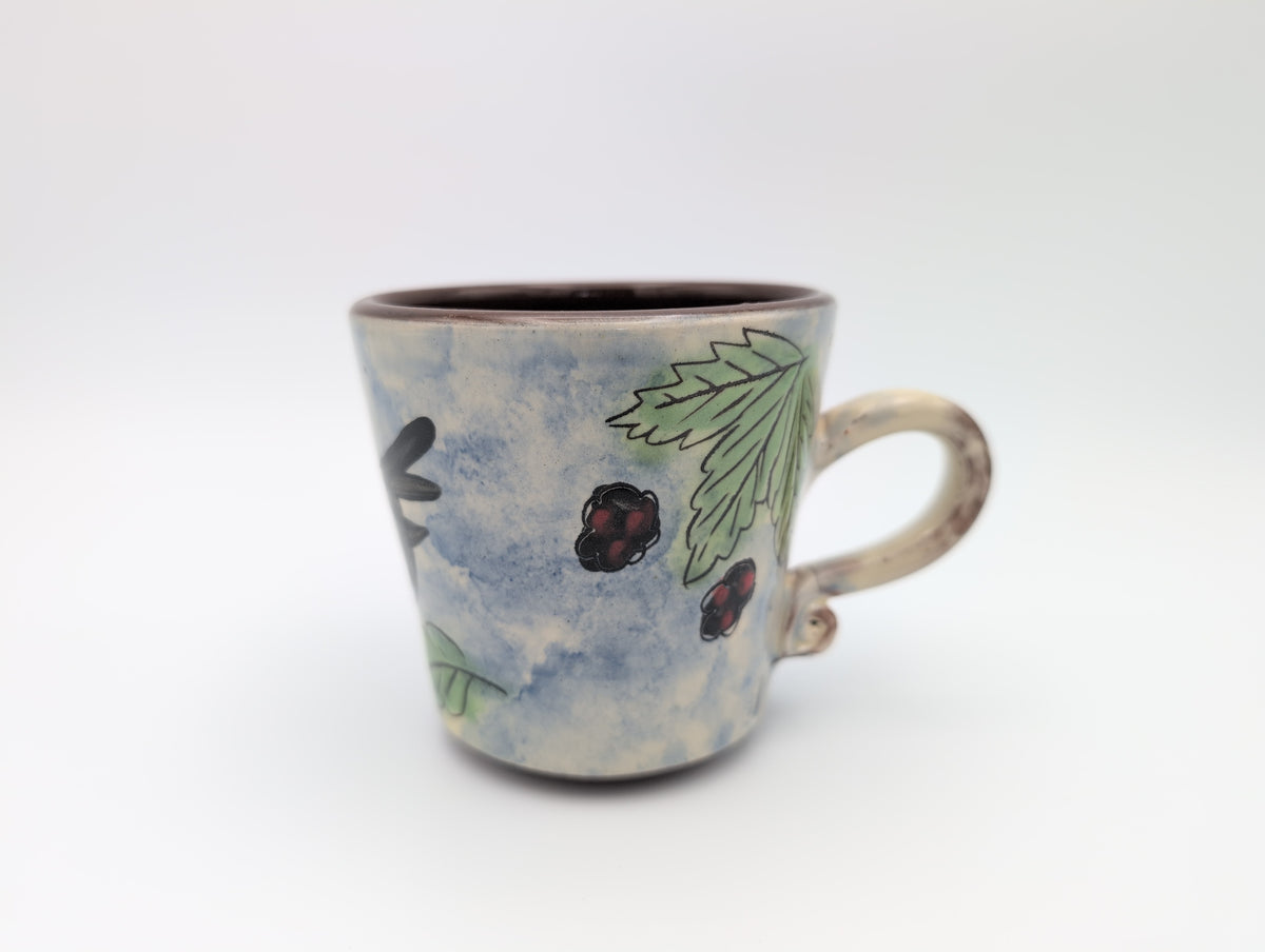 Hand thrown blackbird mug