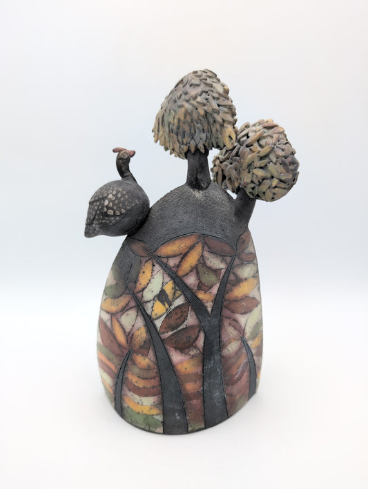 Guinea fowl on a hill