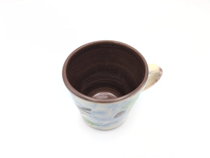 Hand thrown blackbird mug