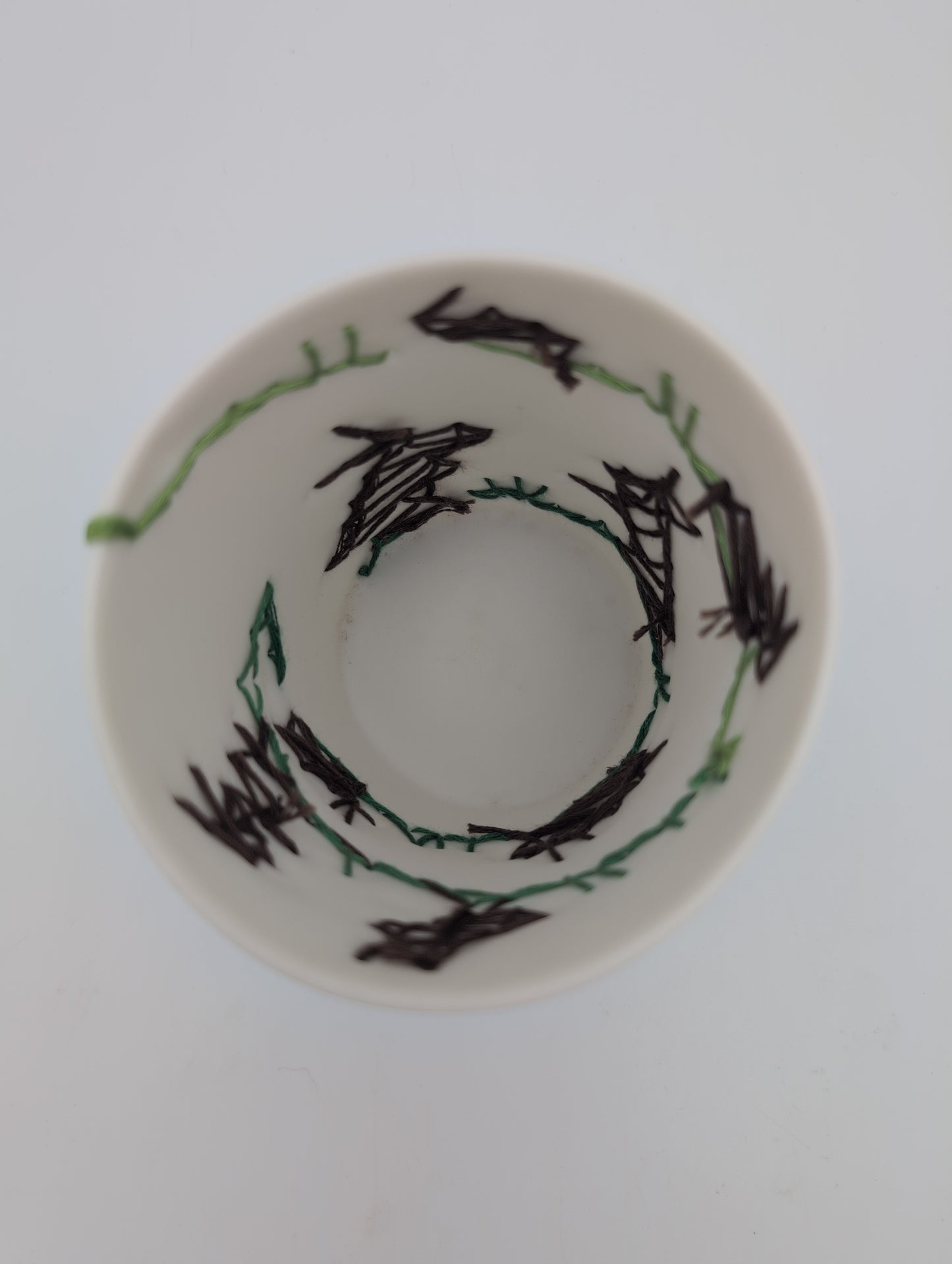 Porcelain beaker with silk hand stitching