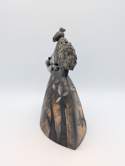 Hare on a hill with tree and blackbird