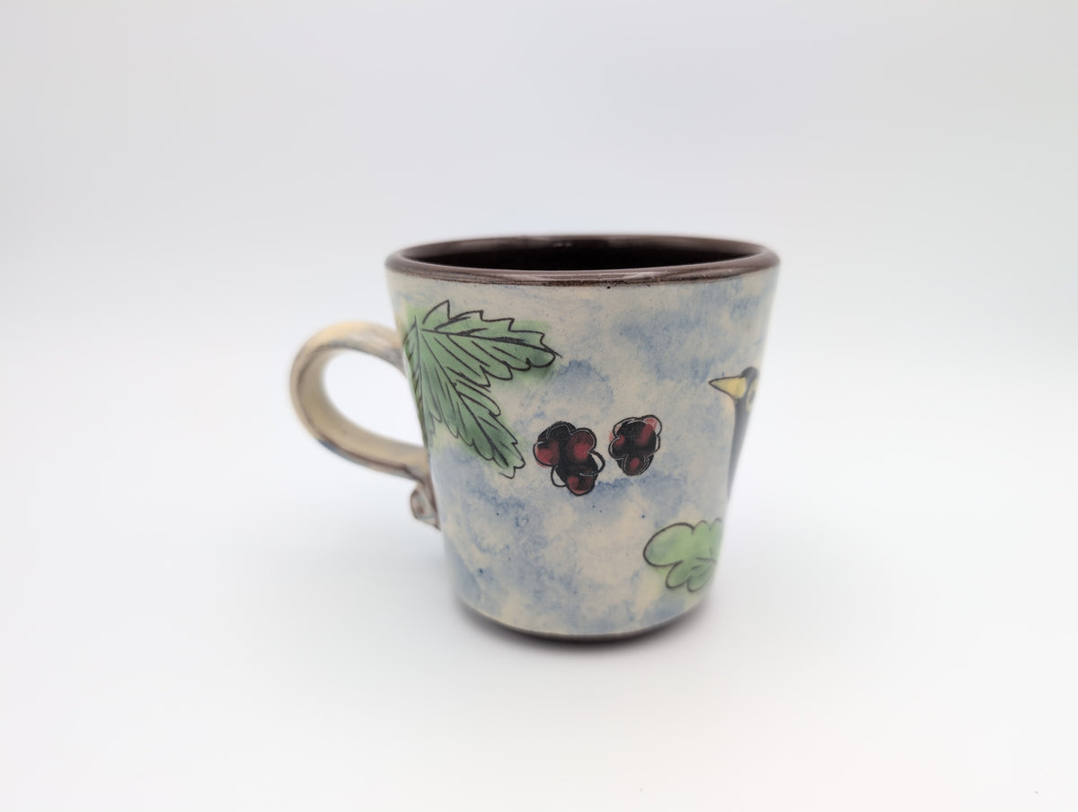 Hand thrown blackbird mug