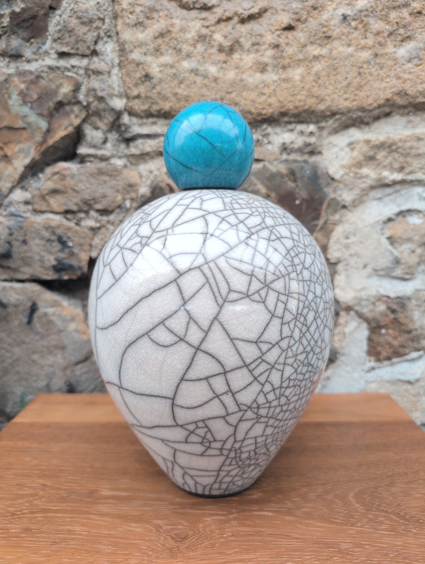 Large raku vase with turquoise stopper