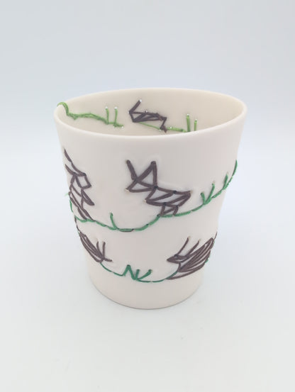 Porcelain beaker with silk hand stitching