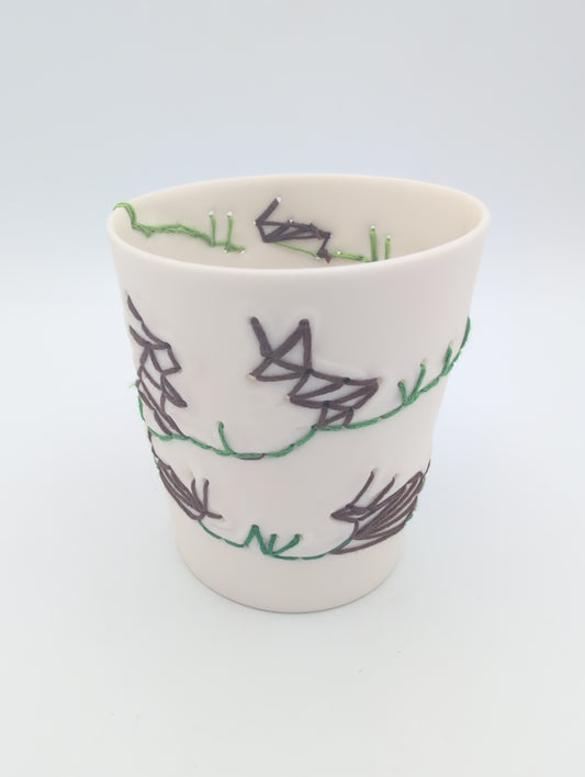 Porcelain beaker with silk hand stitching